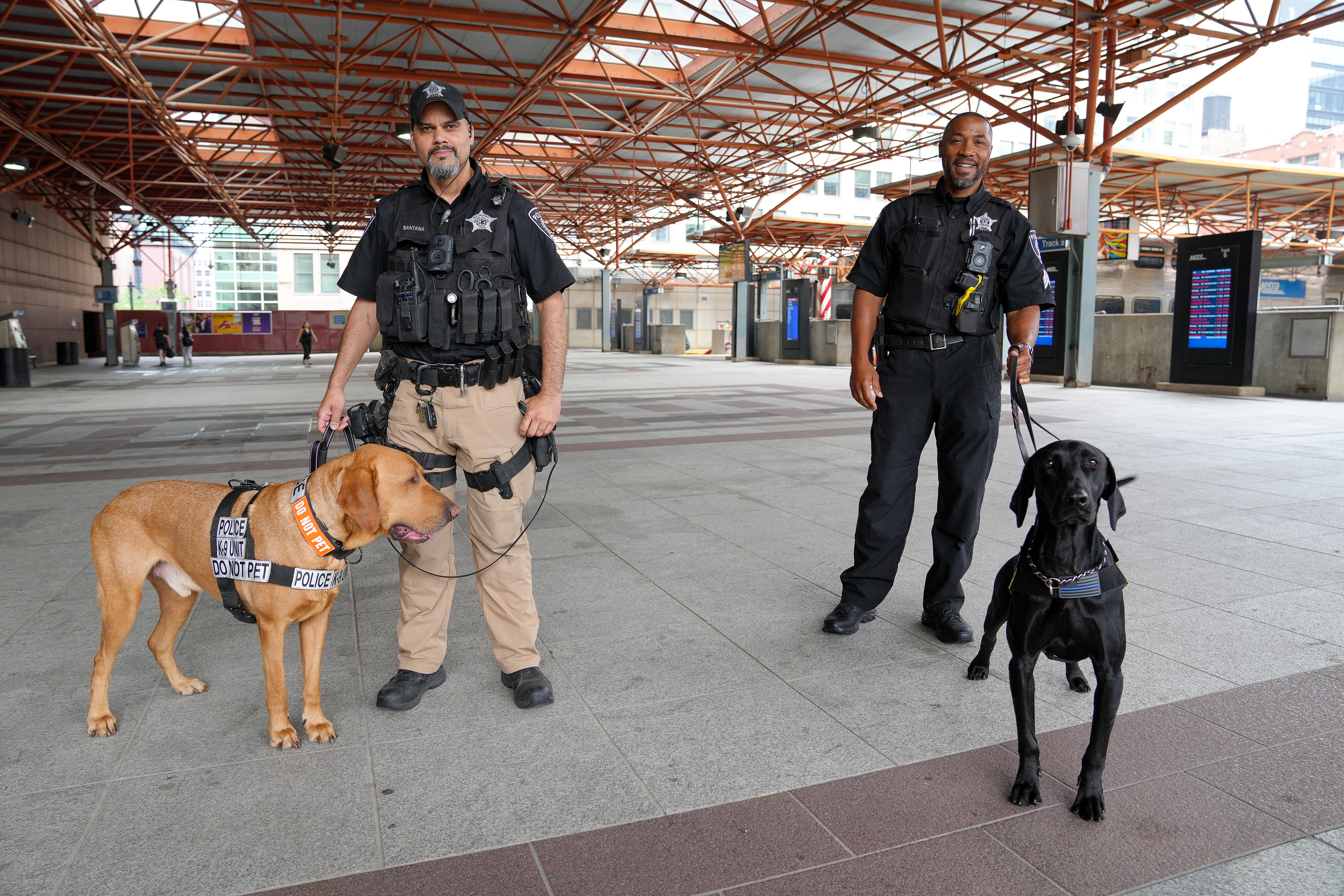 Metra police officers with their K9 partners