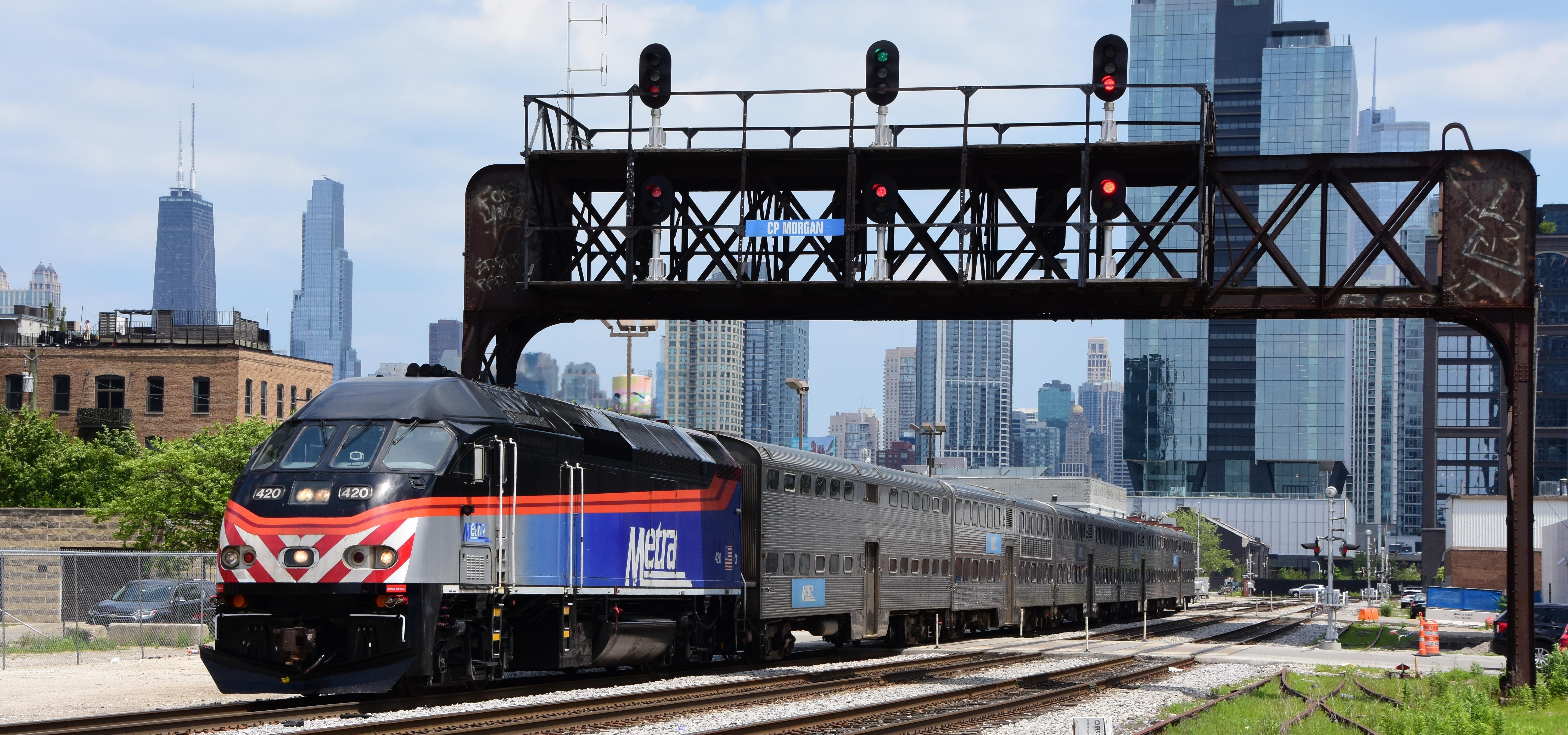 Metra train with the chicago skyline in the background